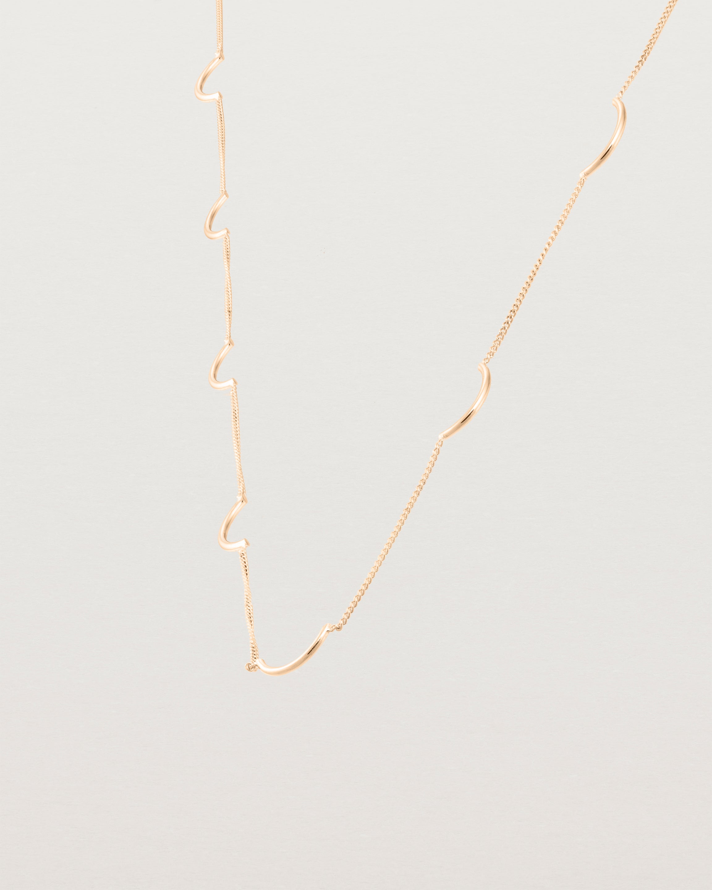 Angled view of the Lai Chain Necklace in rose gold.