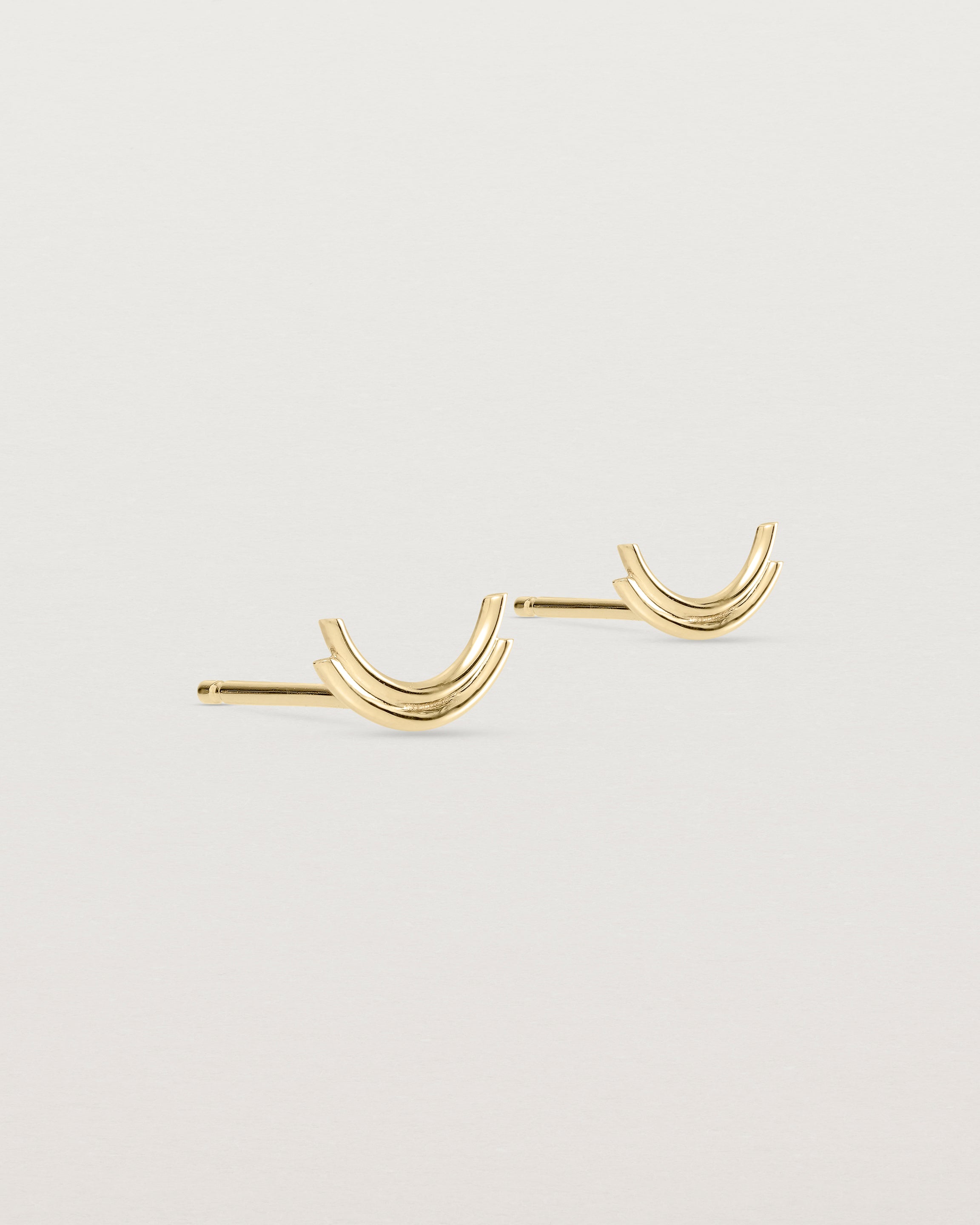 Angled view of the Lai Studs in yellow gold.