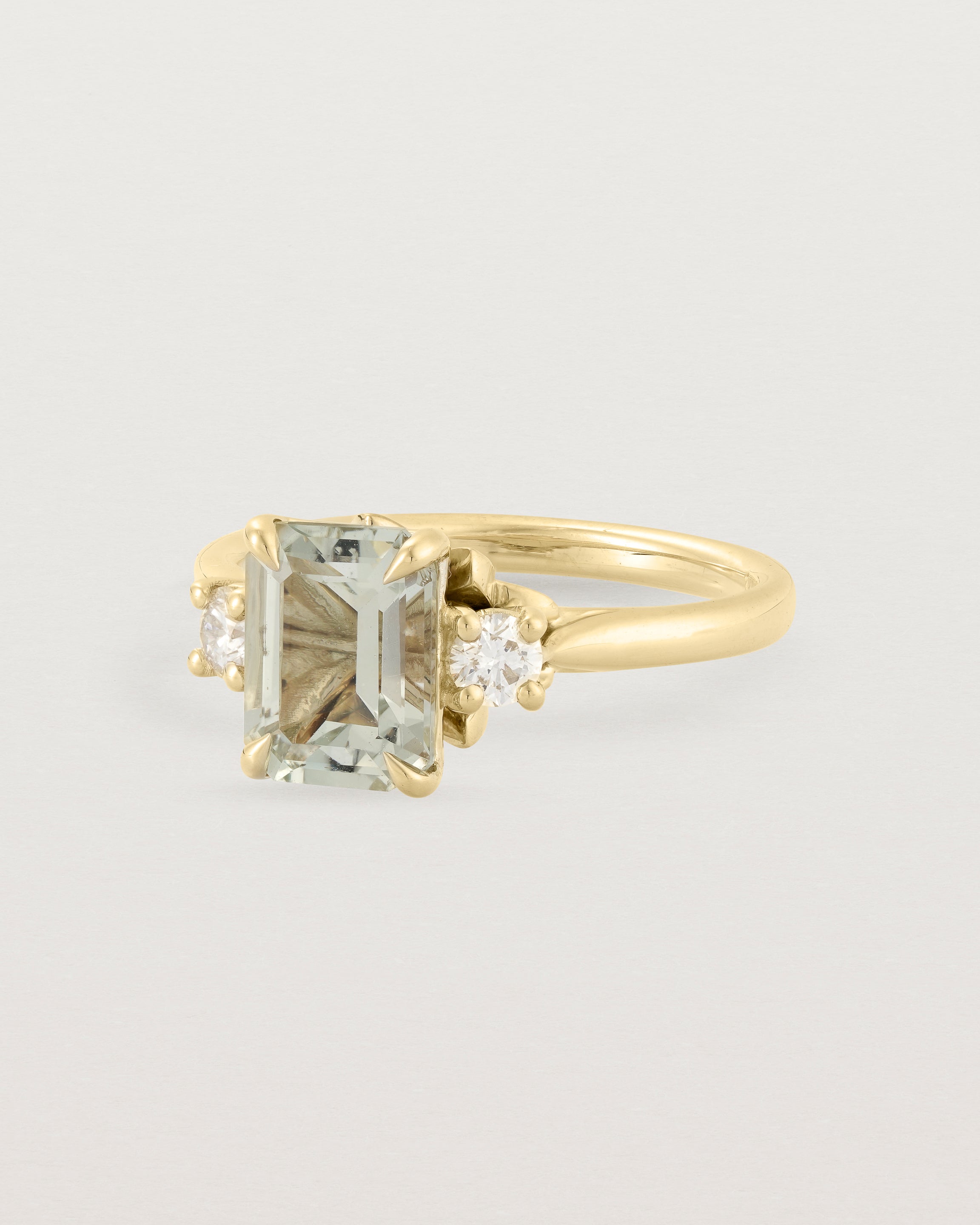 Angled view of the Laurel Emerald Trio Ring | Green Amethyst | Yellow Gold.