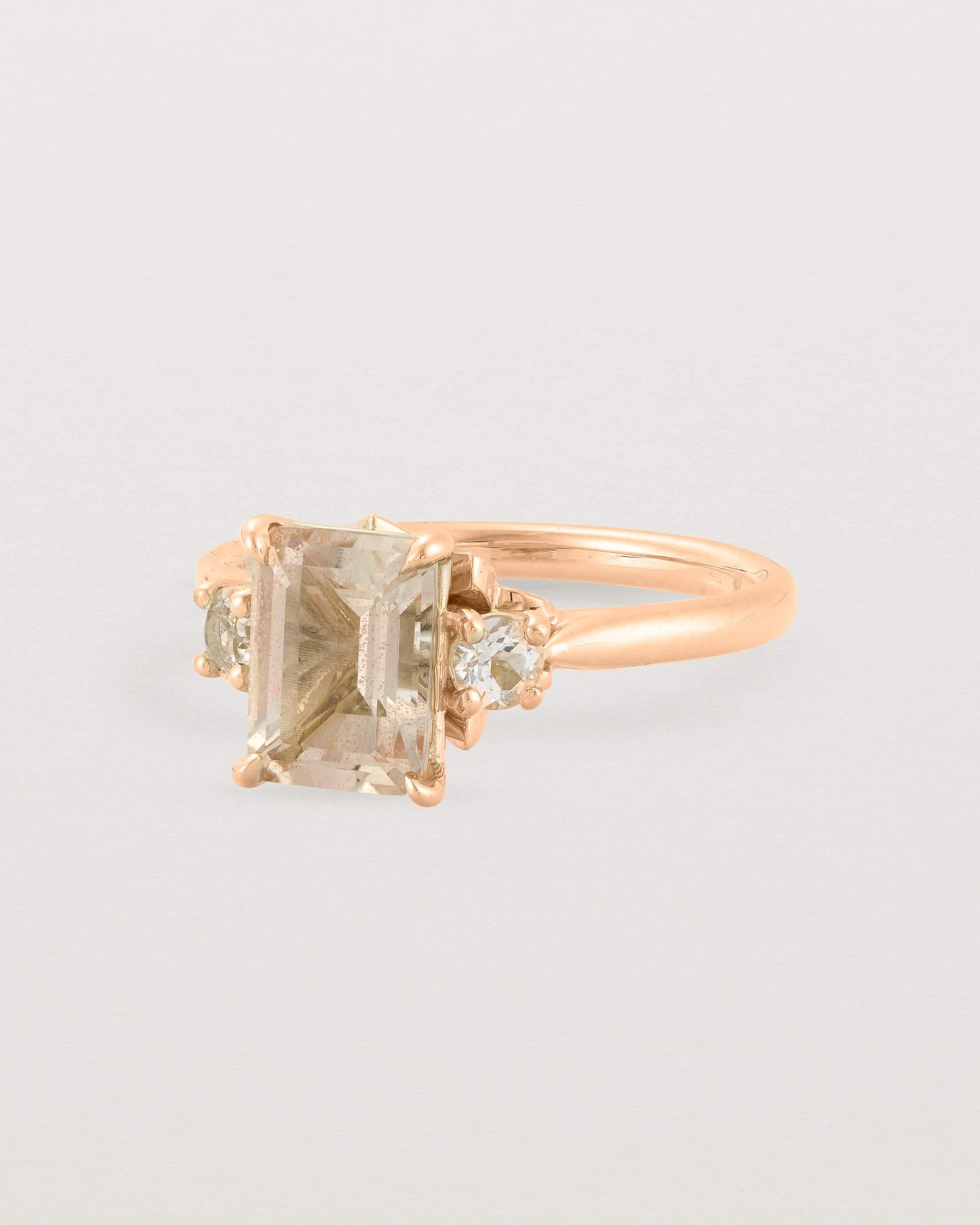 Side view of the Laurel Emerald Trio Ring | Savannah Sunstone | Rose Gold.