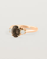 Angled view of the Laurel Oval Trio Ring | Smokey Quartz | Rose Gold.