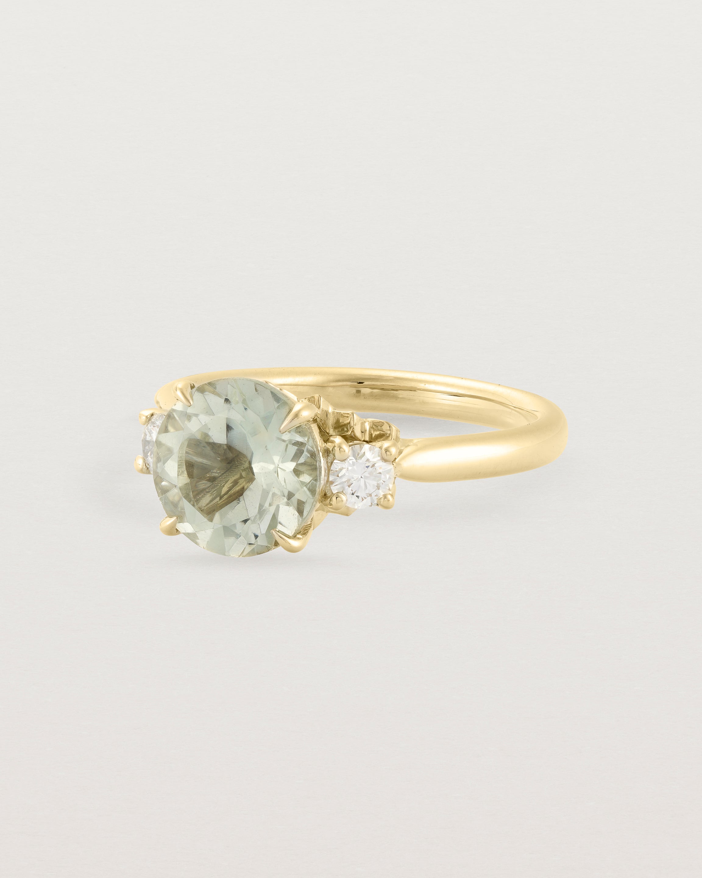 Angled view of the Laurel Round Trio Ring | Green Amethyst | Yellow Gold.
