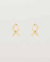 A small pair of yellow gold studs shaped like a tear drop