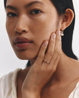 Model wears Lia Solitaire Diamond Ring in yellow gold.