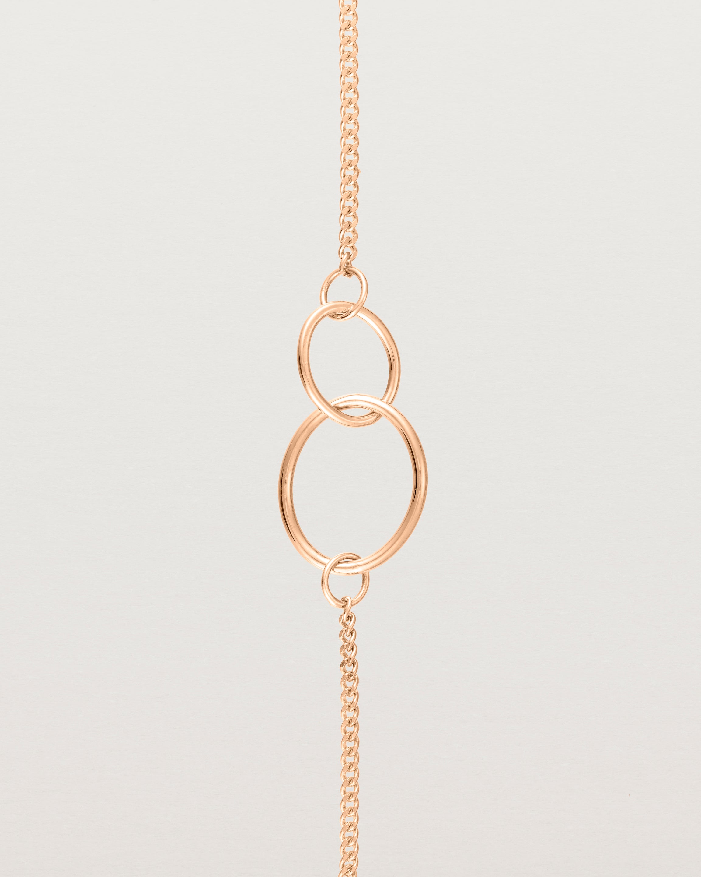 close up view of the loop through oval bracelet in rose gold