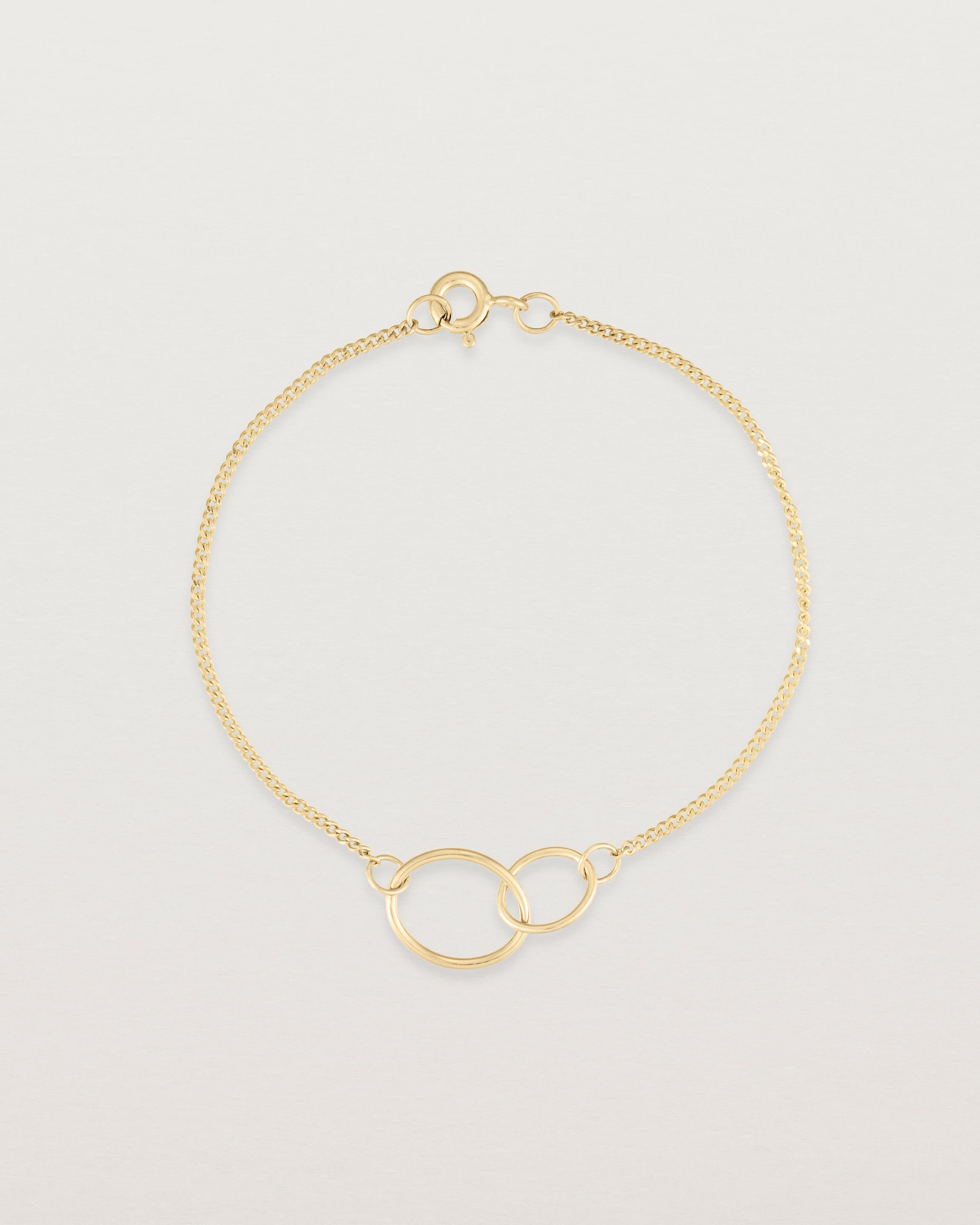 top view of the loop through oval bracelet in yellow  gold