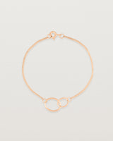 top view of the loop through oval bracelet in rose gold