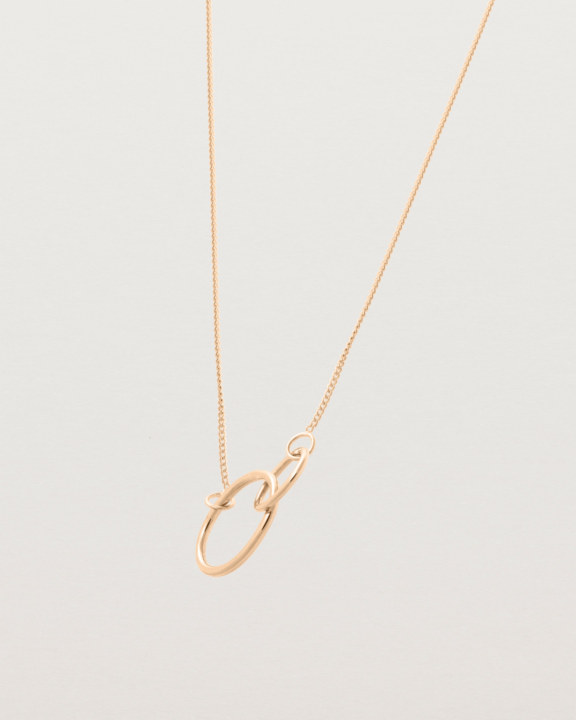 two circles interlinking on a rose gold necklace