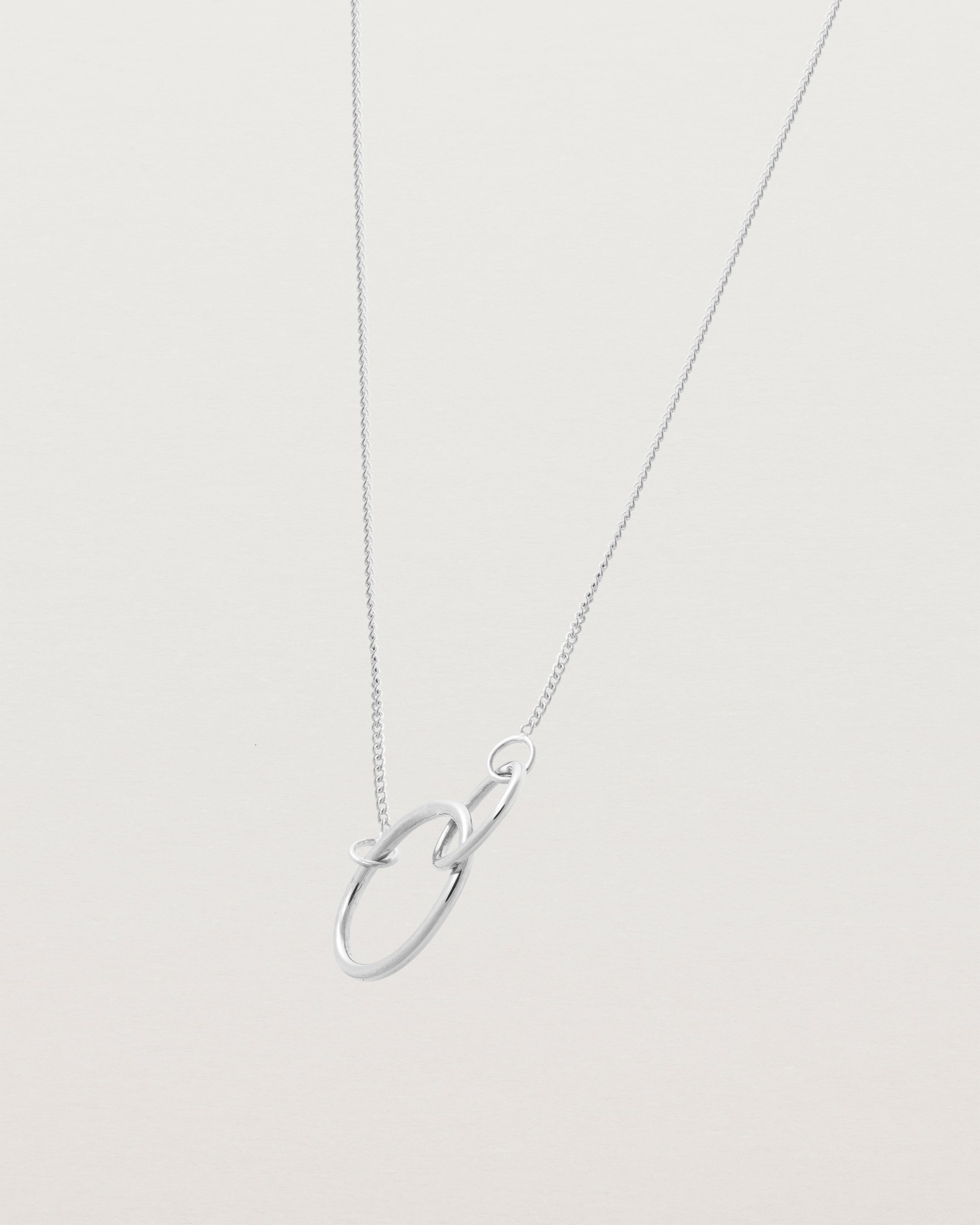 two circles interlinking on a white gold necklace