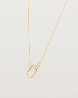 two circles interlinking on a yellow gold necklace