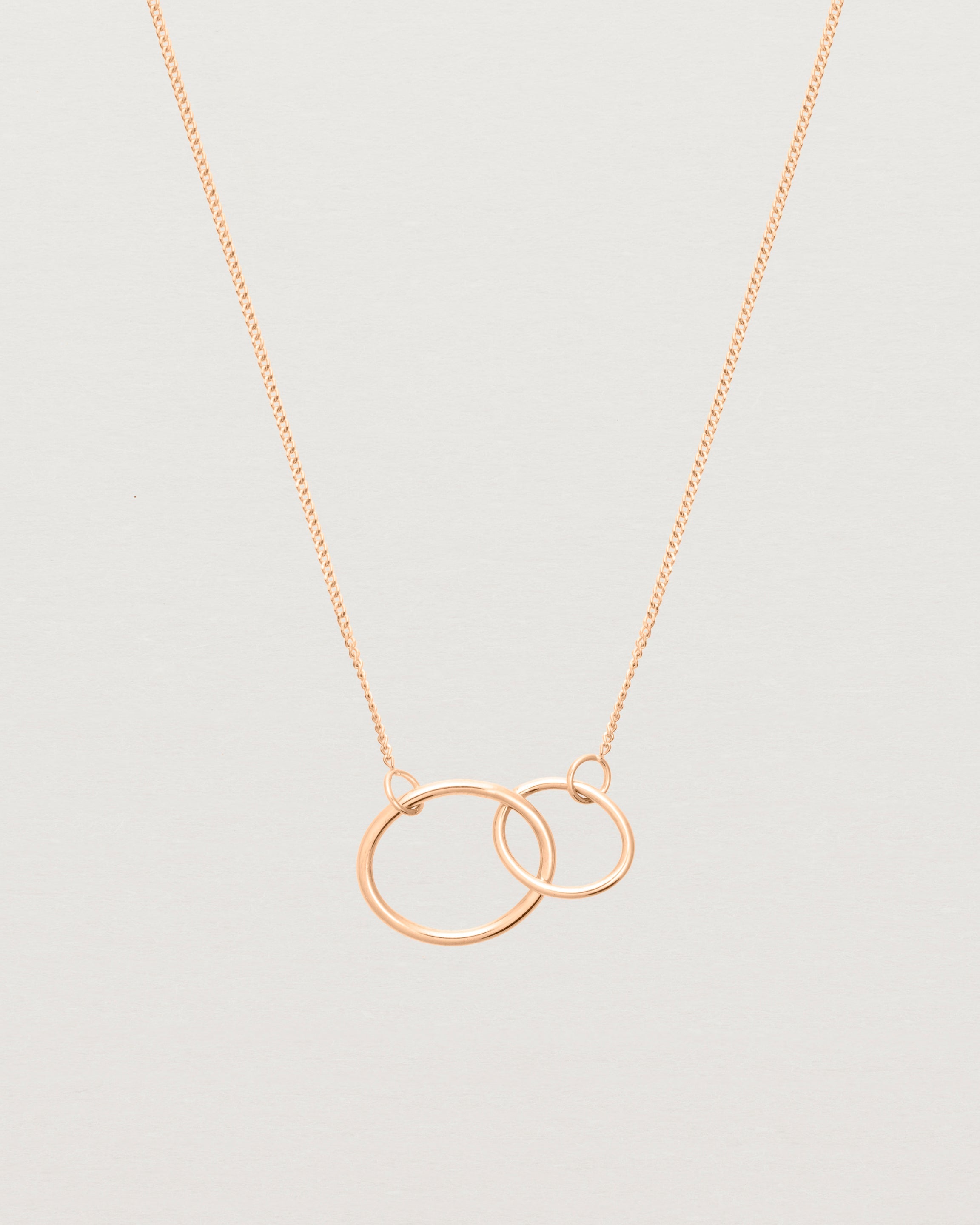 two circles interlinking on a rose gold necklace