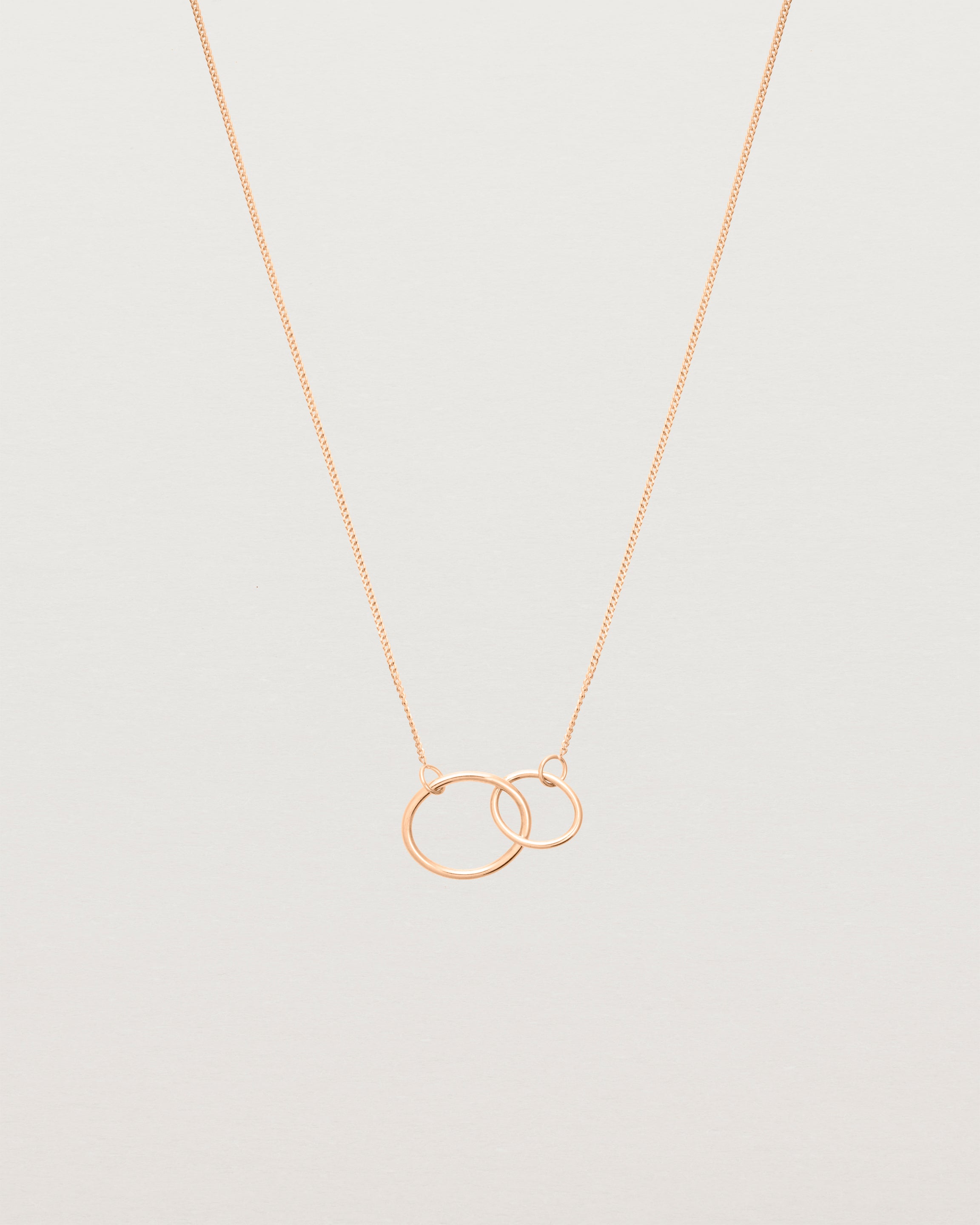 two circles interlinking on a rose gold necklace