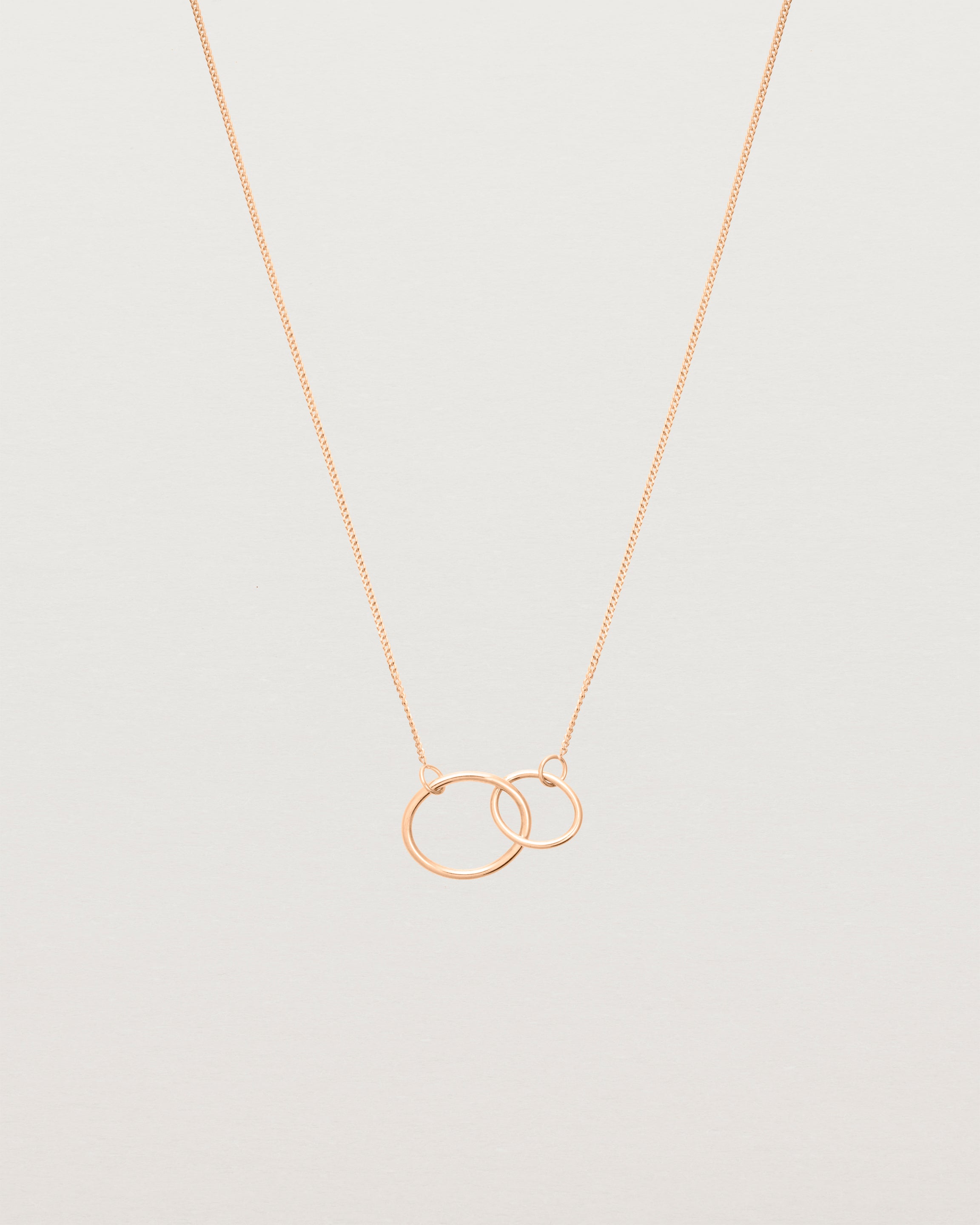 two circles interlinking on a rose gold necklace