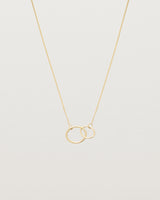 two circles interlinking on a yellow gold necklace