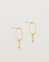 A pair of yellow gold studs featuring two intertwined hanging ovals