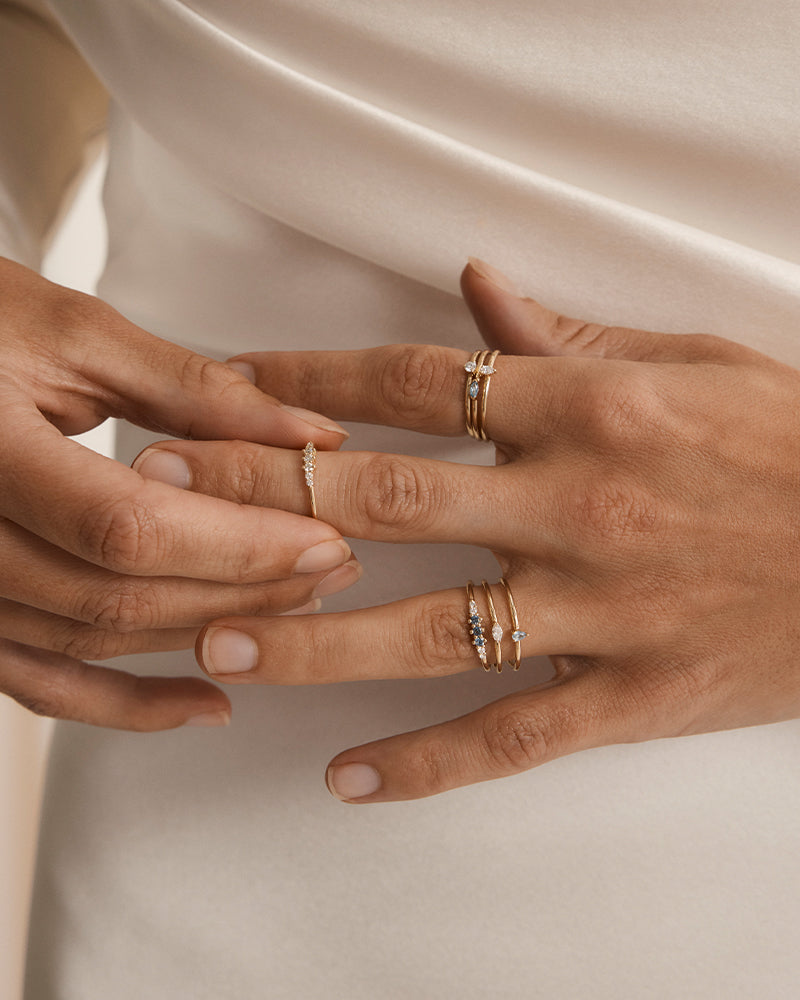 Photo of models hand wearing mulitple natalie marie jewellery rings