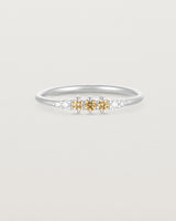 Front facing deep etched image of a white gold ring with citrine birthstones and diamonds.