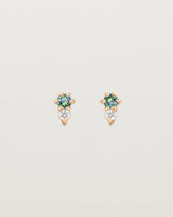 Front facing deep etched image of a pair of rose gold earrings with alexandrite birthstones and diamonds.