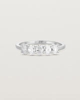 Front on deep etched image of a white gold wrap engagement ring with five oval laboratory grown diamonds.