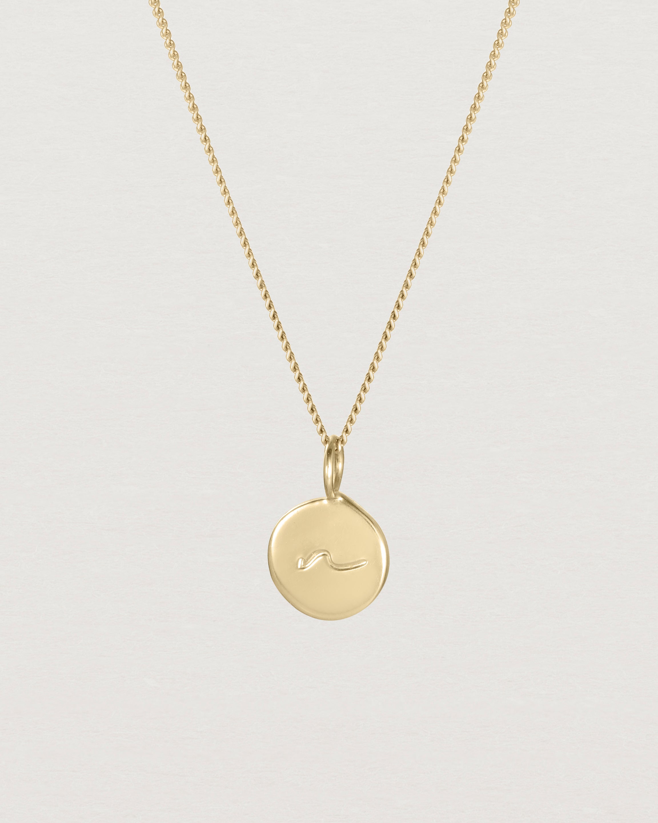 Close up view of the Mae Necklace in yellow gold.