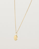 Angled view of the Mae Necklace in yellow gold.