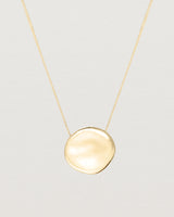 Front view of the Mana Necklace in yellow gold.