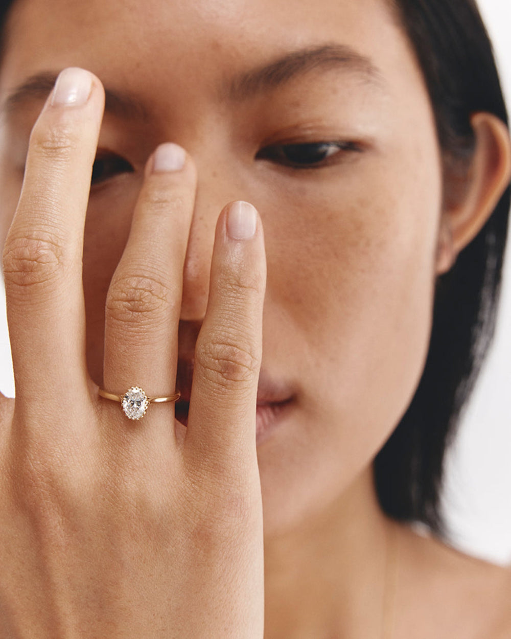 Model wears Mero√´ Oval Solitaire with a Laboratory Grown Diamond.