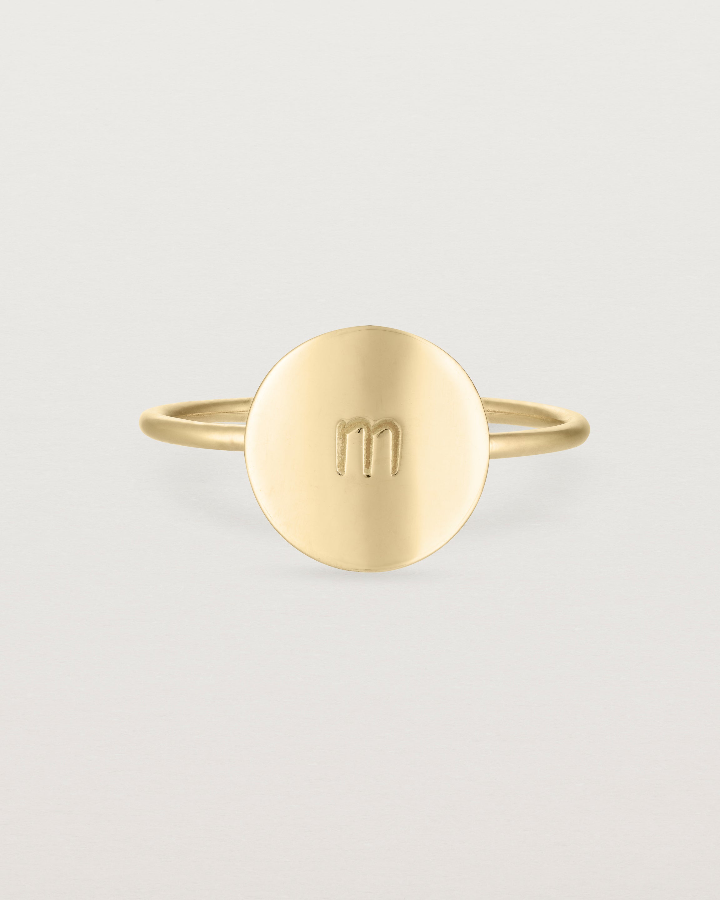 Front view of the Mini Initial Ring in Yellow Gold.