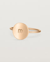 Angled view of the Mini Initial Ring in Rose Gold.