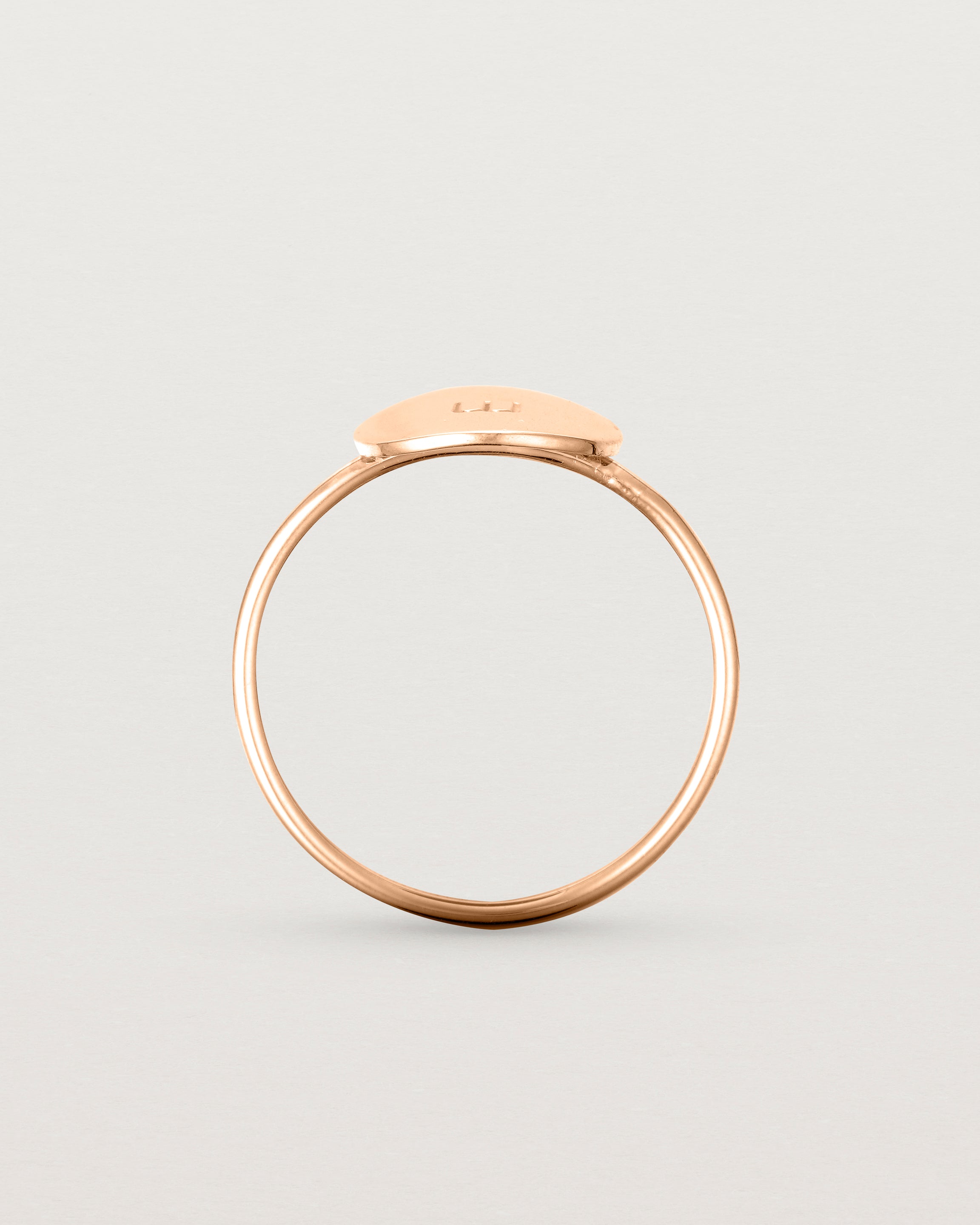 Standing view of the Mini Initial Ring in Rose Gold.