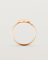 Standing view of the Mini Initial Ring in Rose Gold.