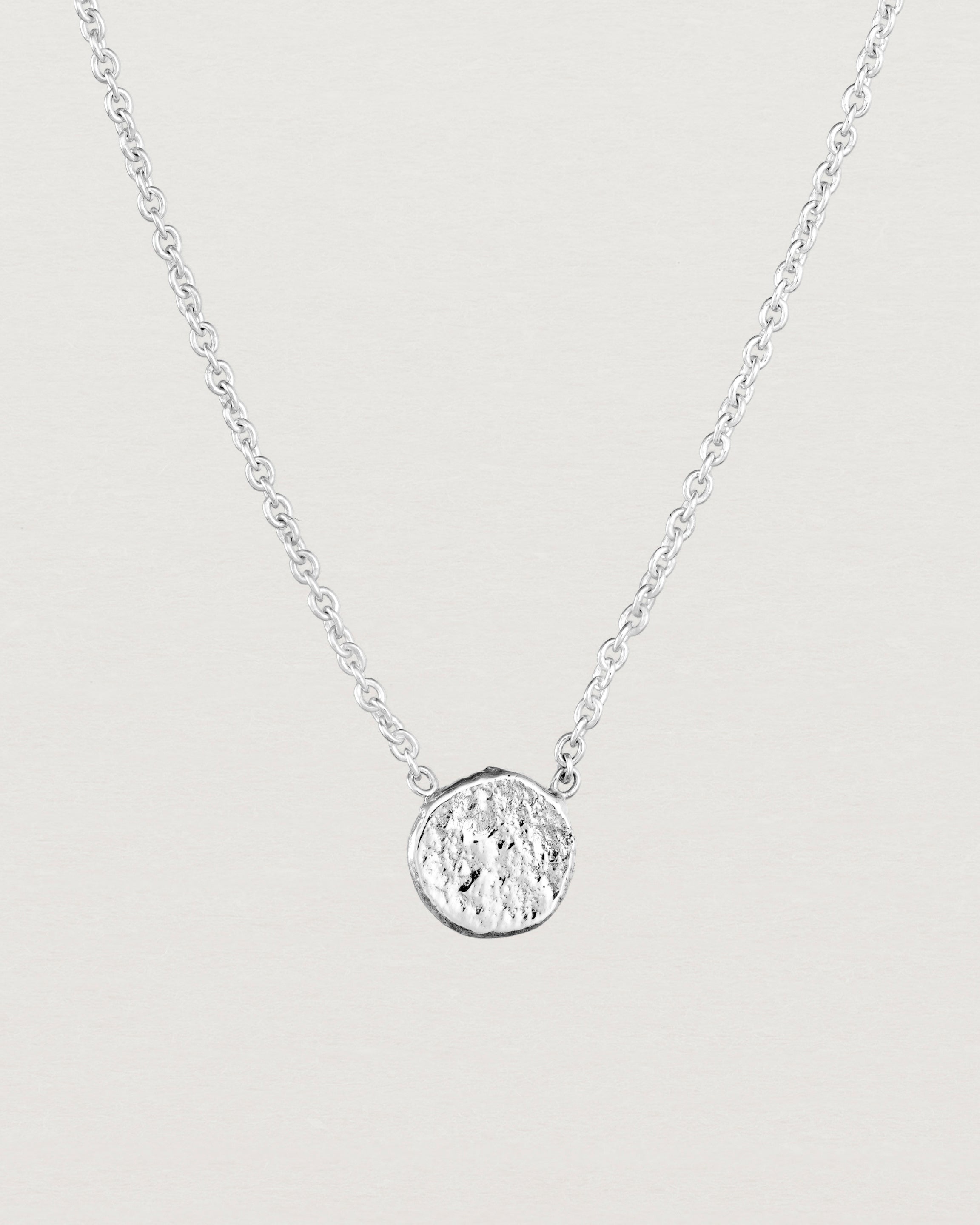 Close up view of the Moon Necklace in sterling silver.