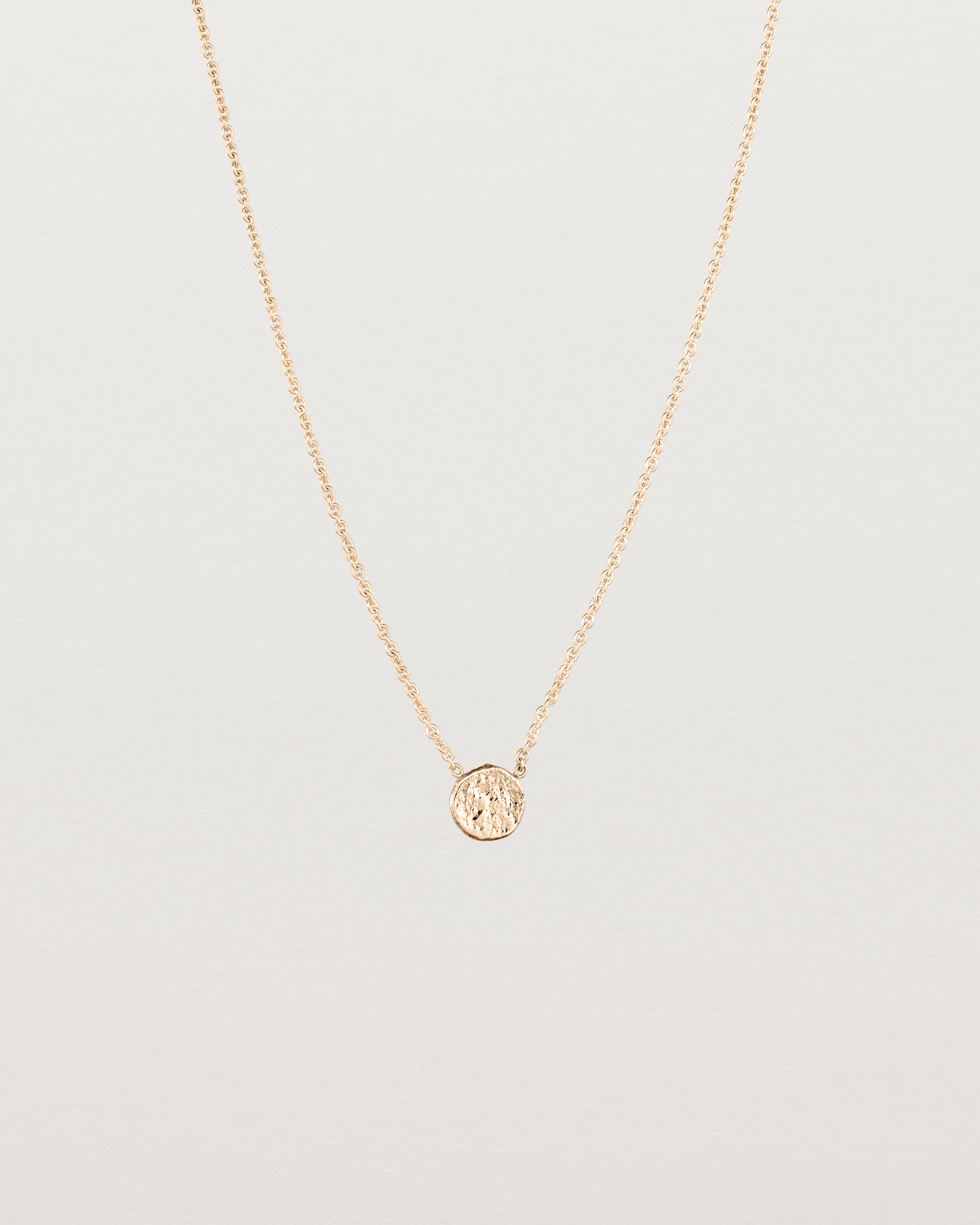 Front view of the Moon Necklace in rose gold.