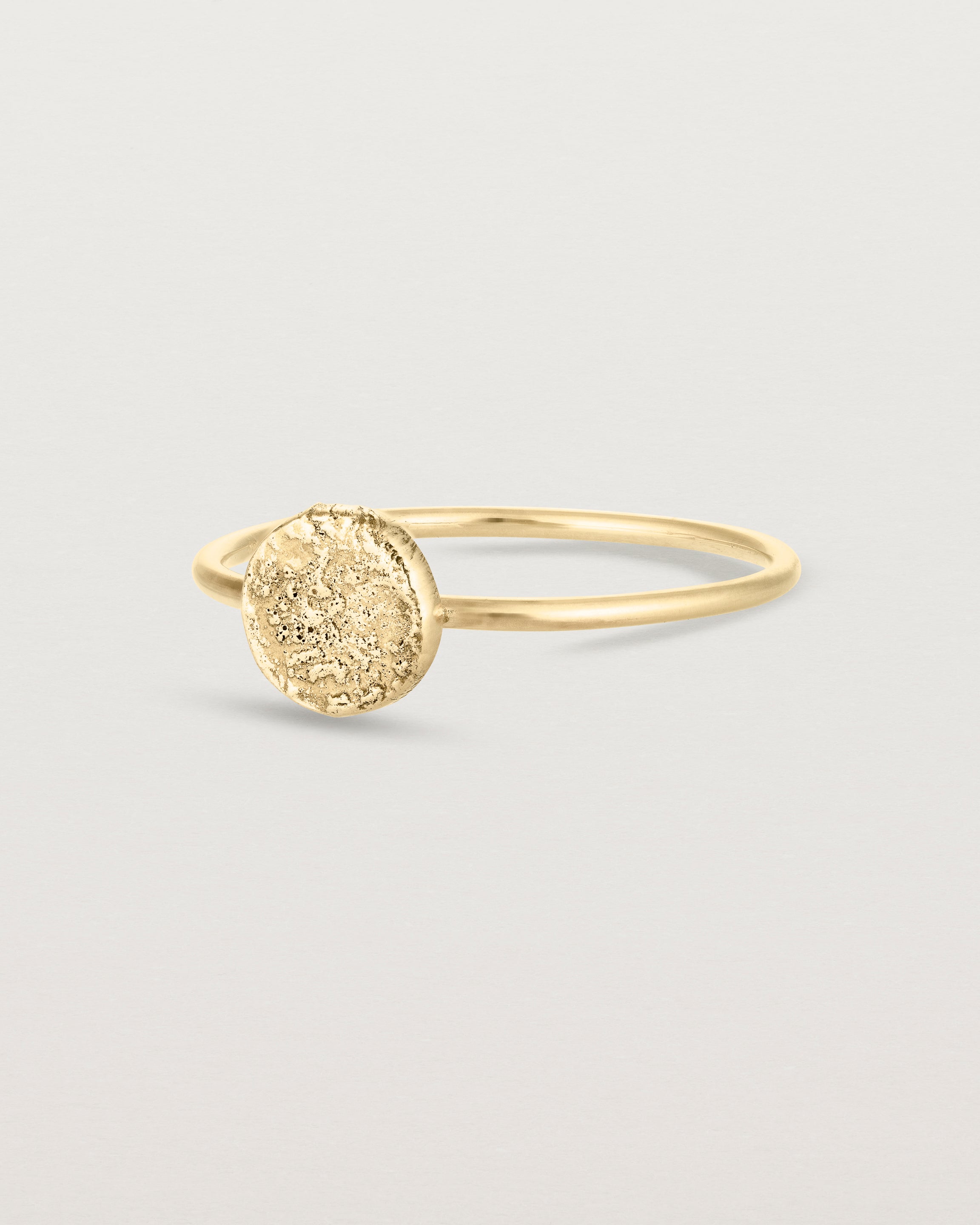 Angled view of the Moon Ring in yellow gold.