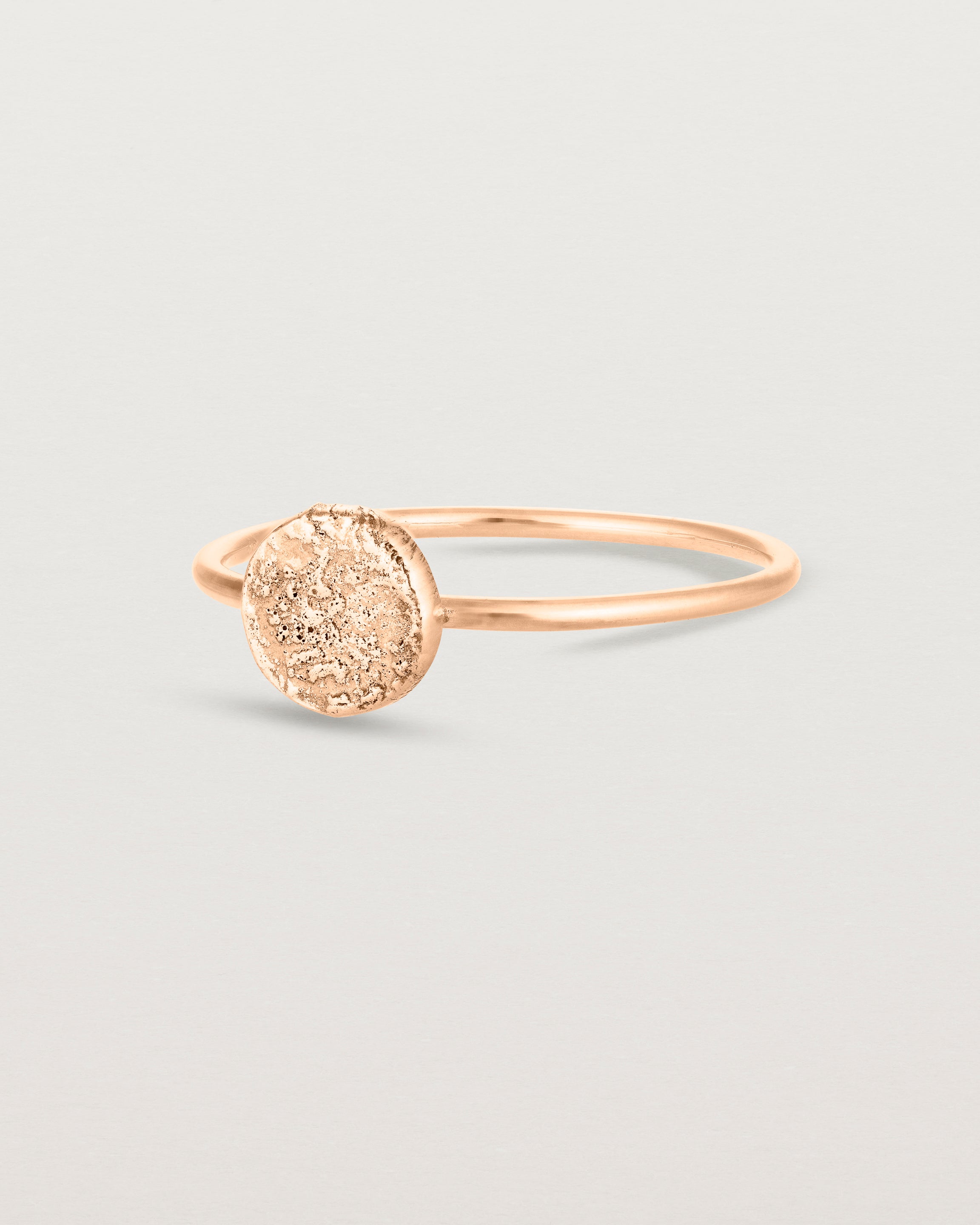 Angled view of the Moon Ring in rose gold.