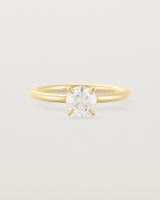 A 0.74ct white diamond is simply set amongst four claws and crafted in 18ct Yellow Gold