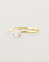 Side view of a 0.74ct white diamond is simply set amongst four claws and crafted in 18ct Yellow Gold