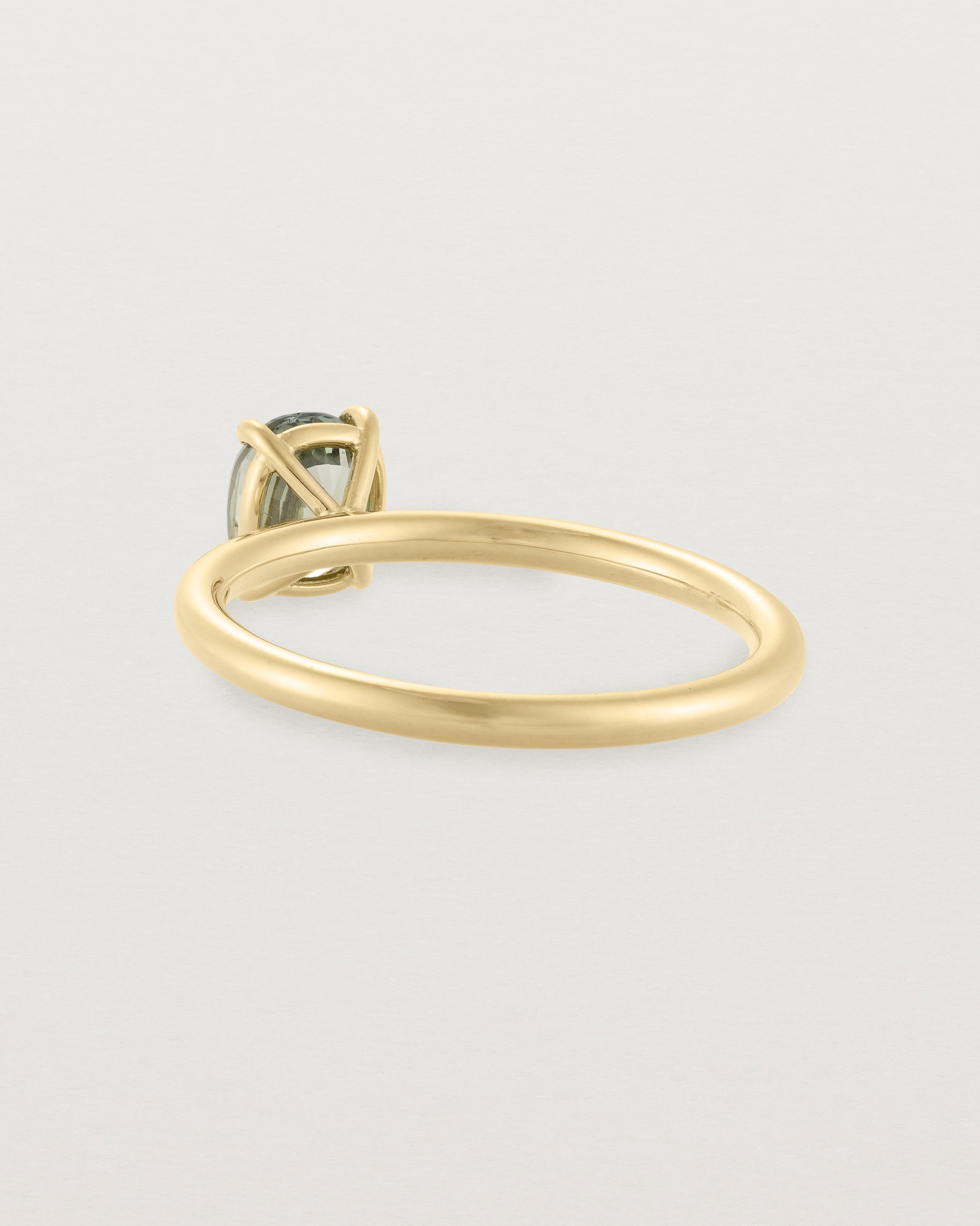 Back view of a striking 0.89 cushion cut Parti Sapphire, sits on a 1.6mm round band and crafted in 18ct Yellow Gold.