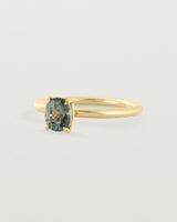 Side view of a striking 0.89 cushion cut Parti Sapphire, sits on a 1.6mm round band and crafted in 18ct Yellow Gold.