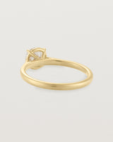 Back view of a 0.90ct round white diamond, adorns a 1.6mm half round 18ct Yellow Gold band.