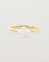 A 0.90ct round white diamond, adorns a 1.6mm half round 18ct Yellow Gold band. 