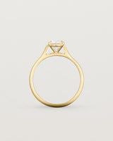 Side profile of a 0.90ct round white diamond, adorns a 1.6mm half round 18ct Yellow Gold band.