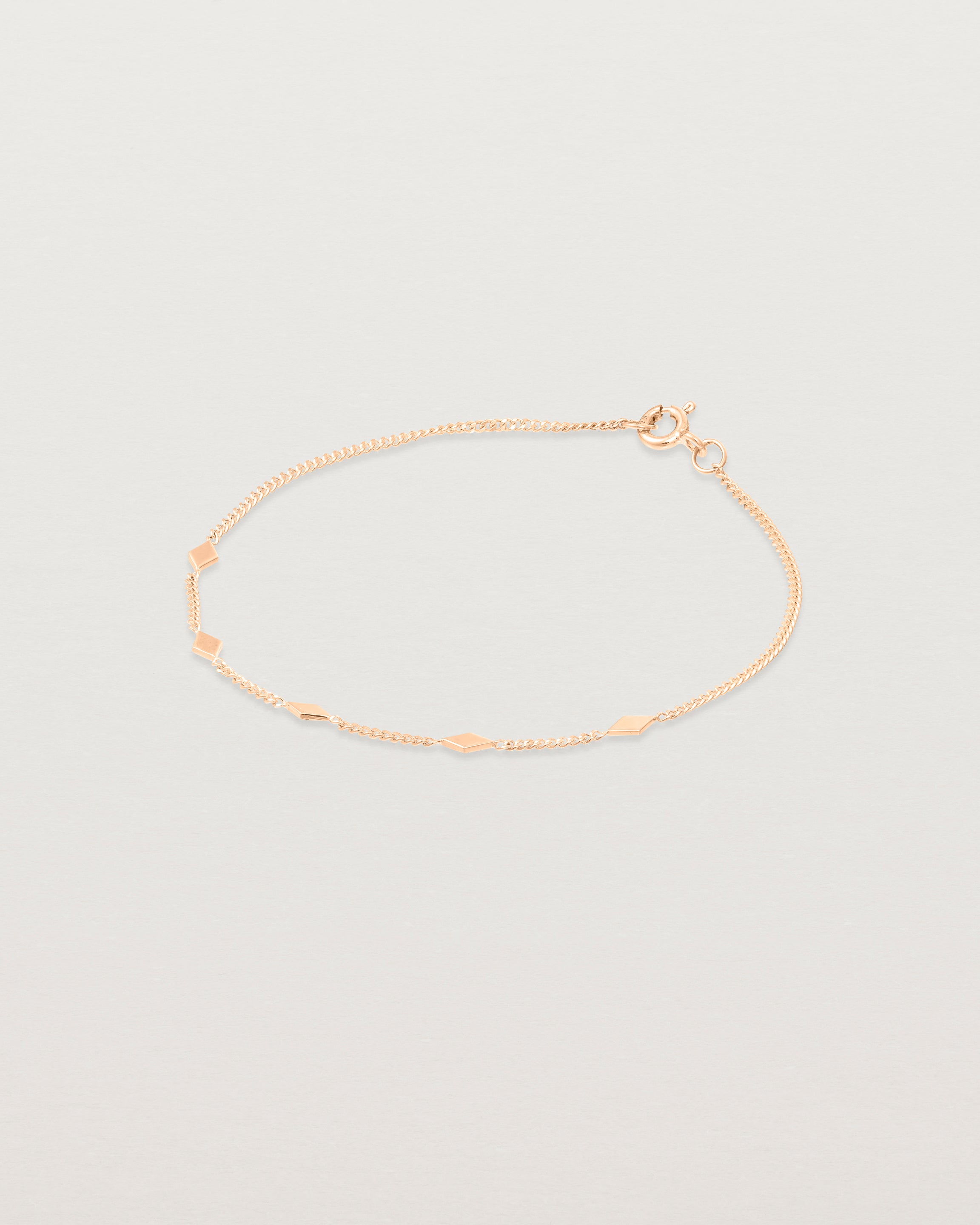 Slight angled view of the Nuna Charm Bracelet in Rose Gold.