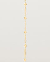 Close up of the Nuna Charm Bracelet in Yellow Gold.