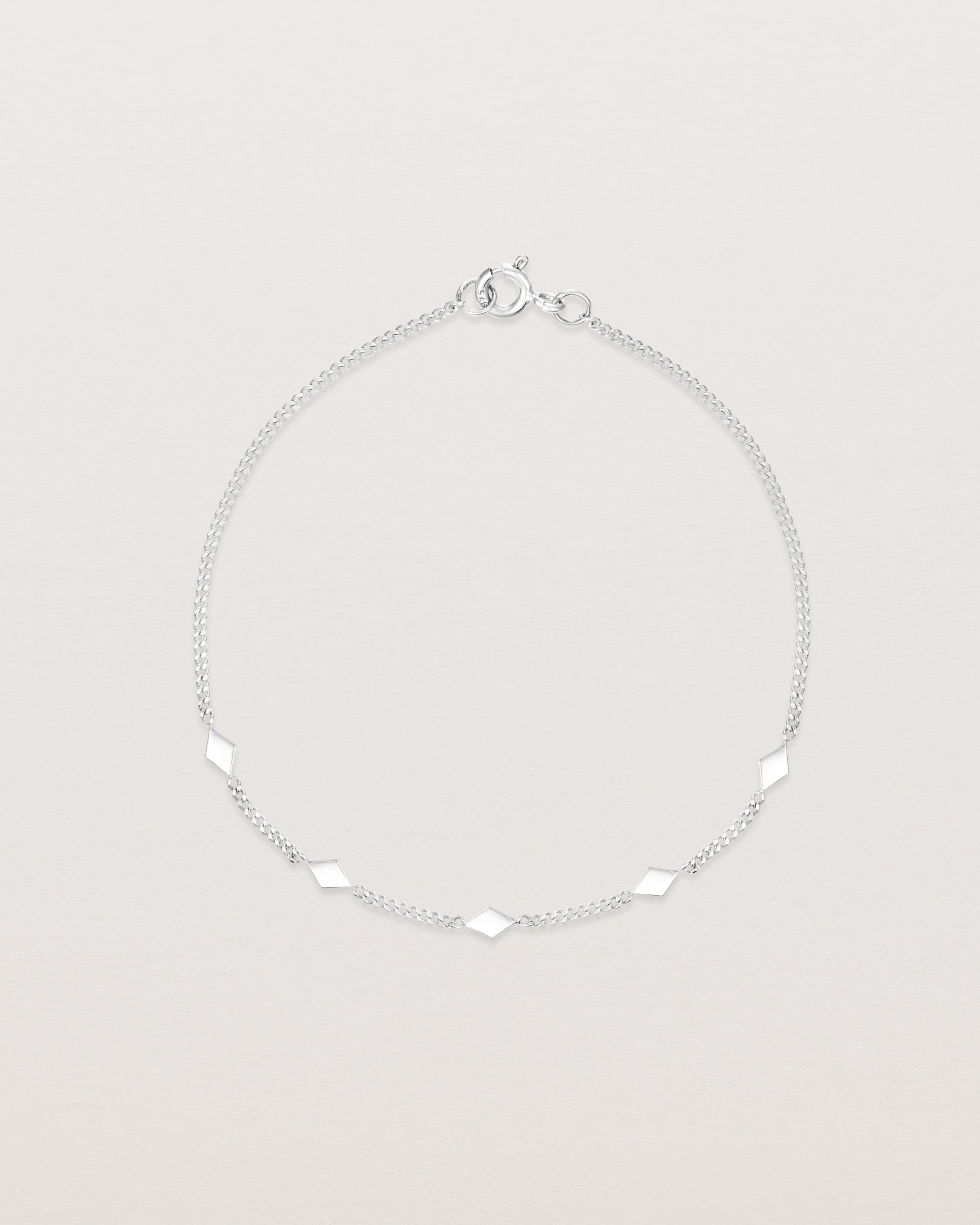 Top down view of the Nuna Charm Bracelet in Sterling Silver.