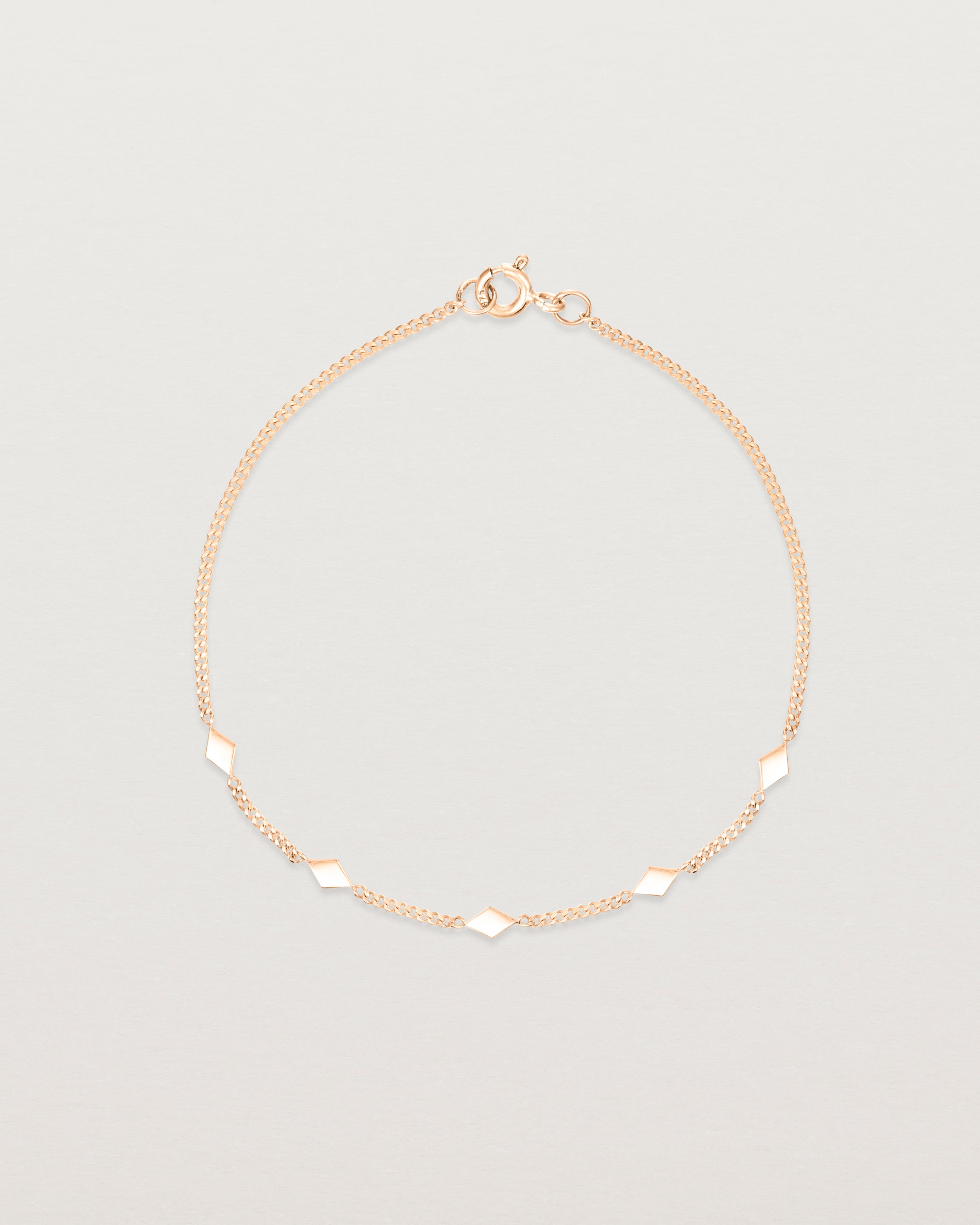 Top down view of the Nuna Charm Bracelet in Rose Gold.