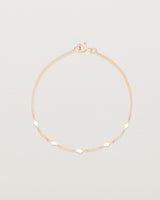 Top down view of the Nuna Charm Bracelet in Rose Gold.