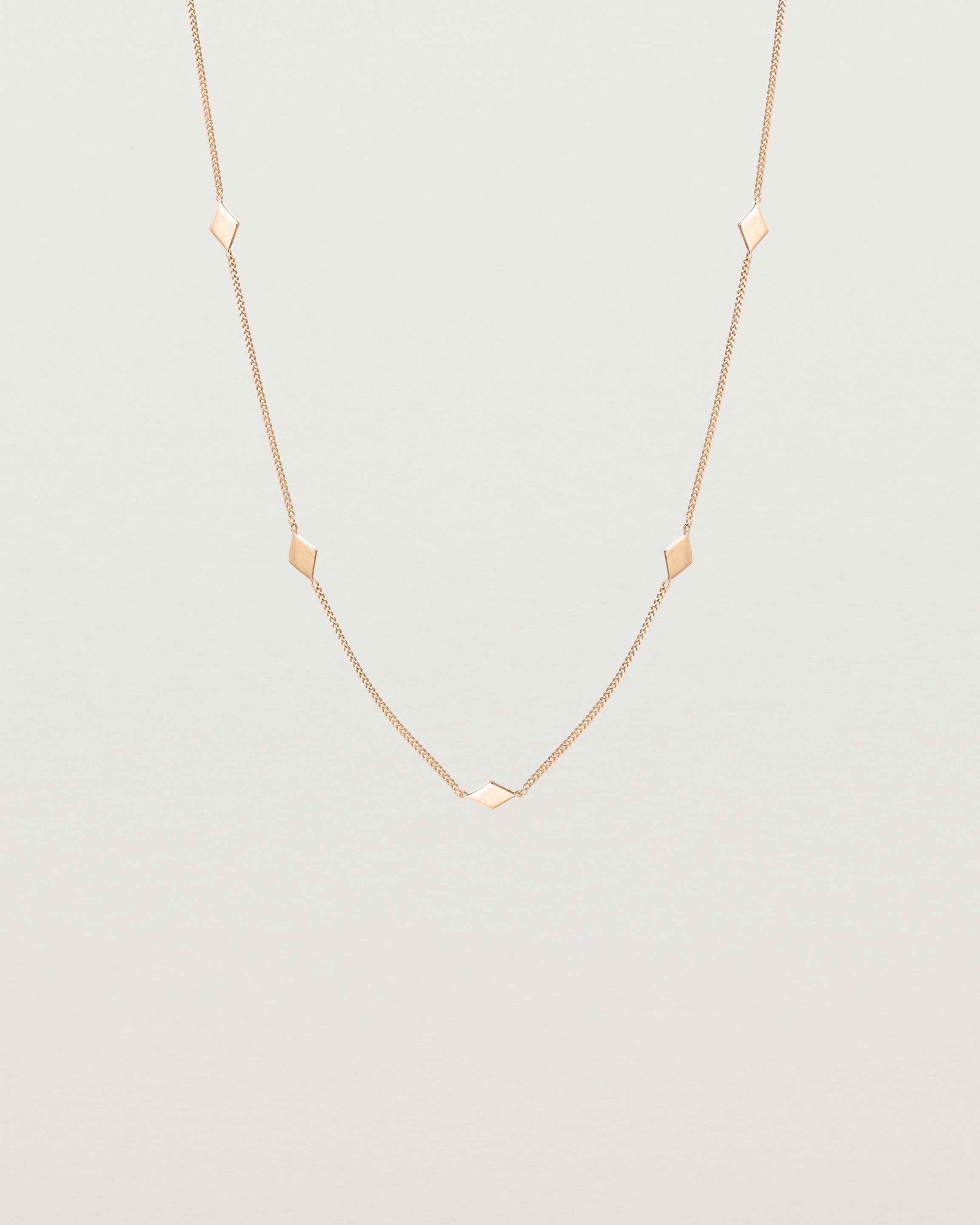Front view of the Nuna Charm Necklace in rose gold.