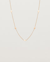Front view of the Nuna Charm Necklace in rose gold.
