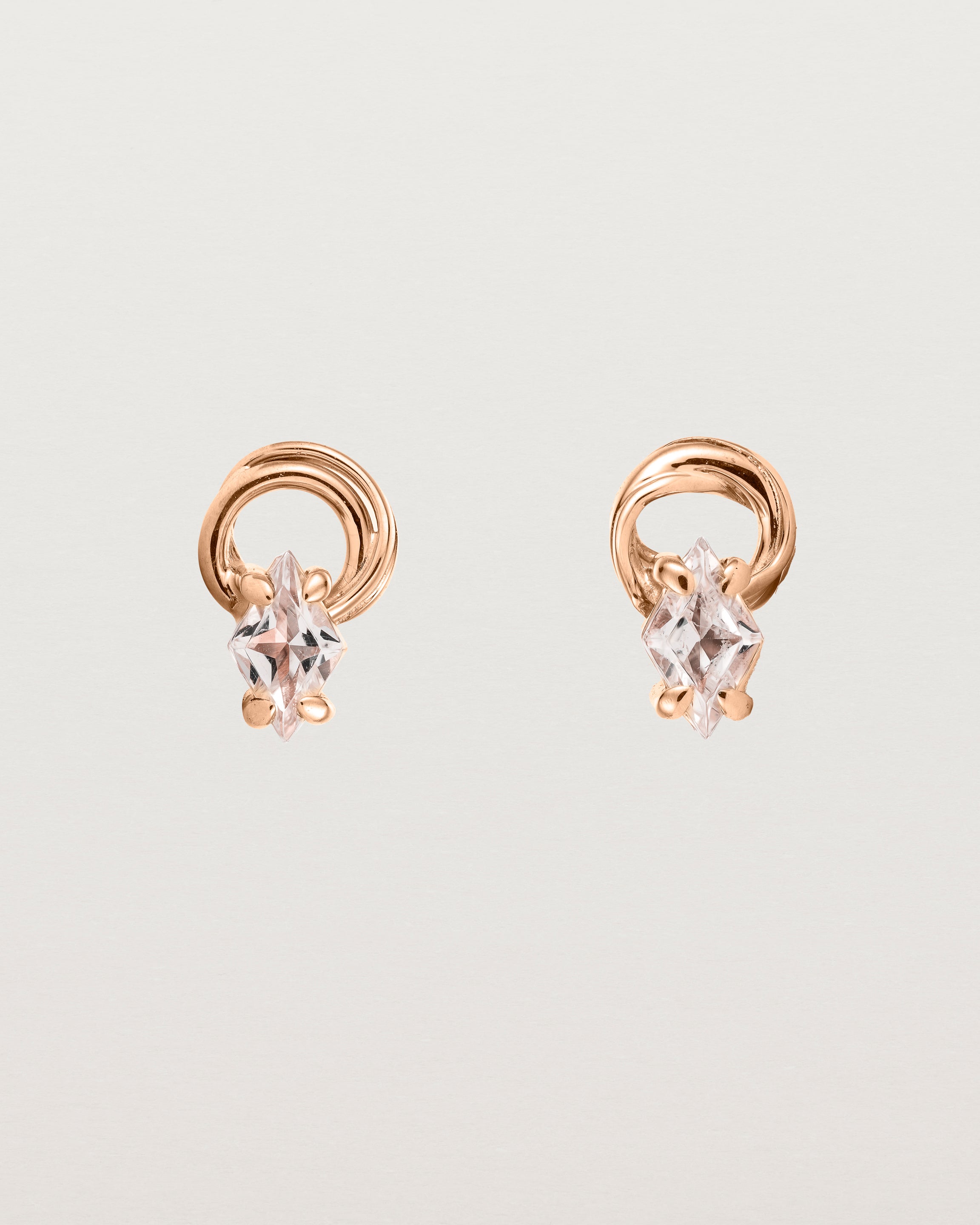 A pair of rose gold studs featuring an ascher cut pale yellow sunstone